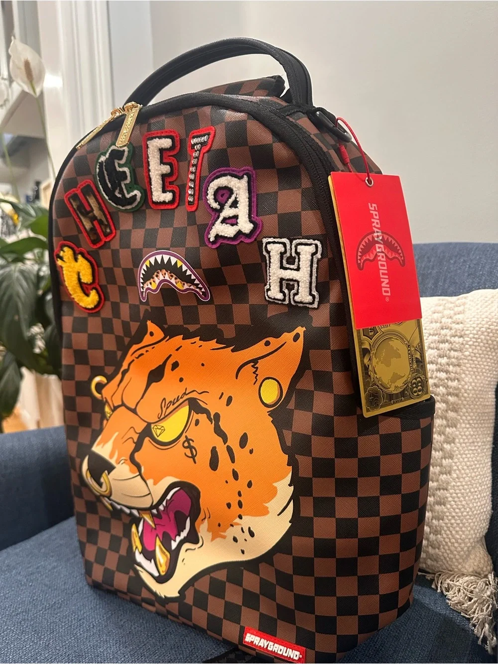 Sprayground Brown Checkerboard Backpack with Orange Tiger Patch